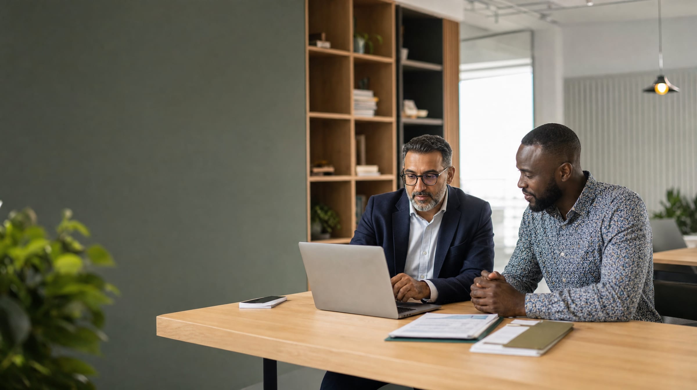 Accountant and client reviewing documents together at 12D Accounting